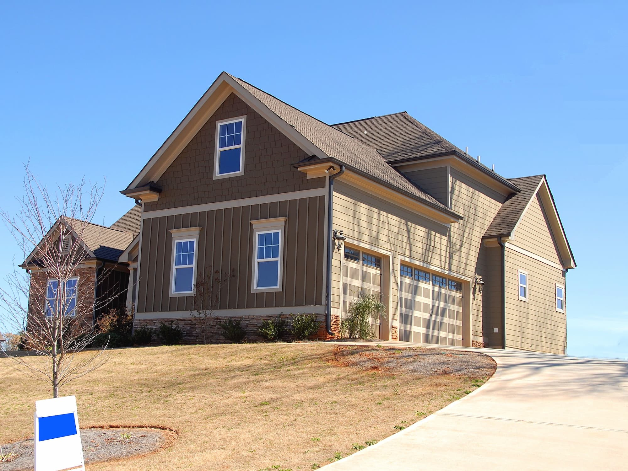 hardie siding brown house on a hill